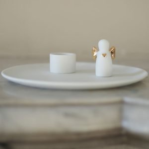 Porte bougie sur assiette en porcelaine petit ange