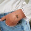 Bracelet croix sertie de tourmalines sur fil or